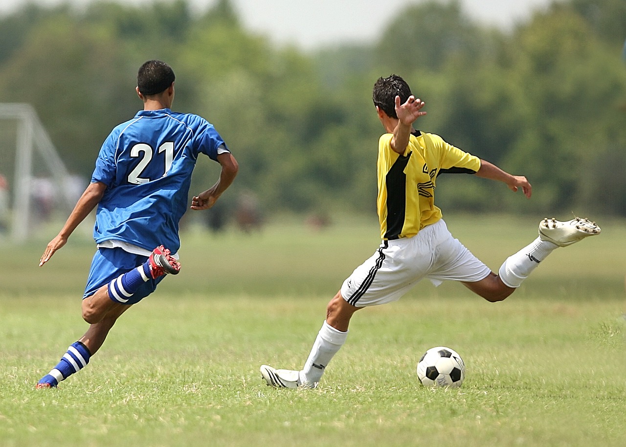 Teen boys playing soccer