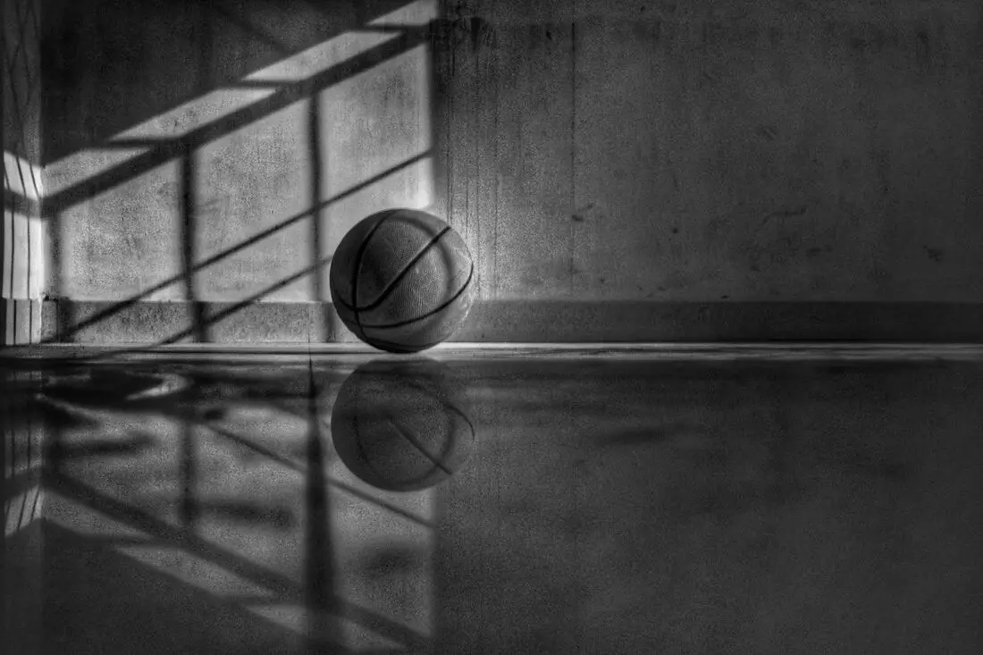 basketball bouncing on a dark floor