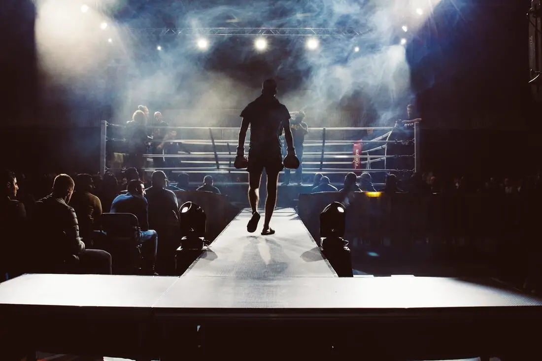 a boxer approaches the boxing ring