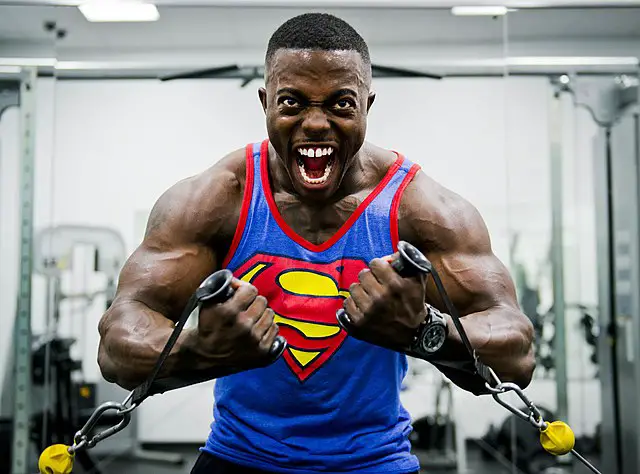 Bodybuilder in superman tank top