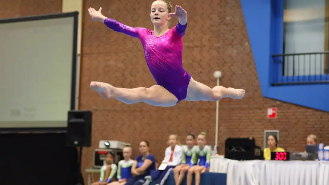 Girl competing in gymnastics